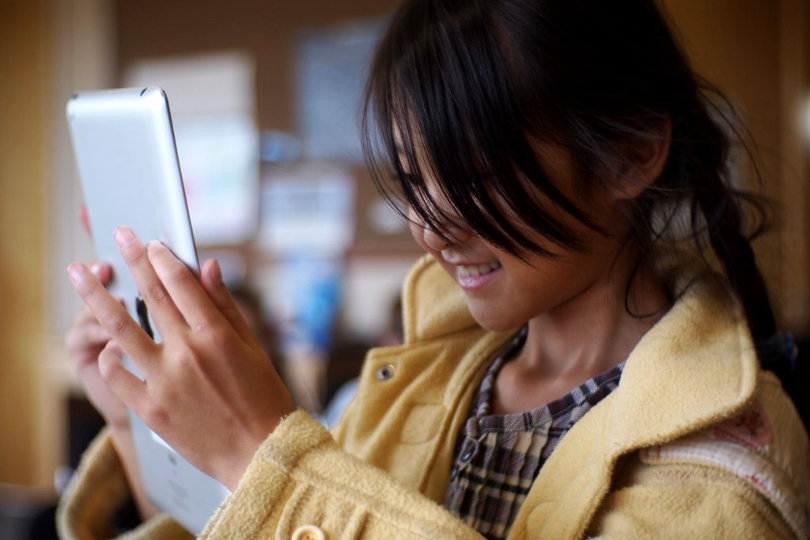 Student using iPad at school