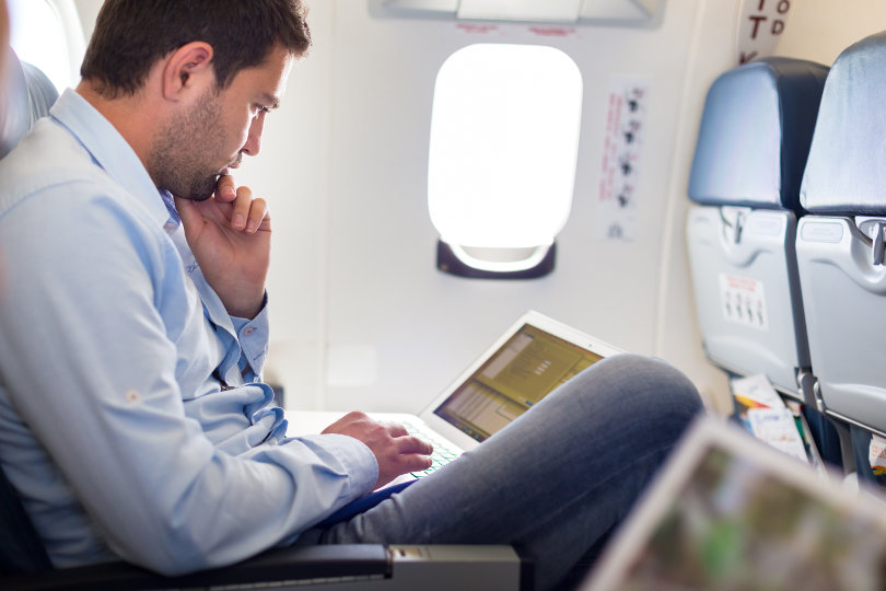 Businessman working on the airplane