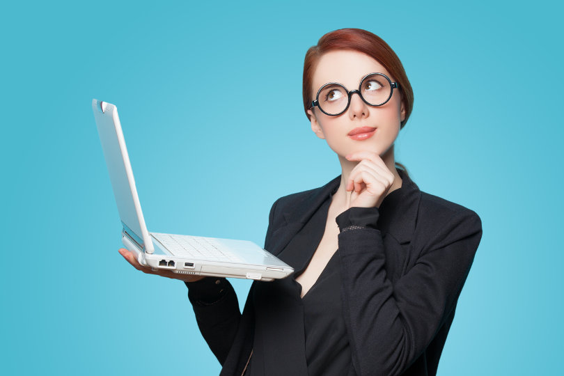 Thinking businesswoman with laptop