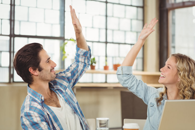 High five between colleagues