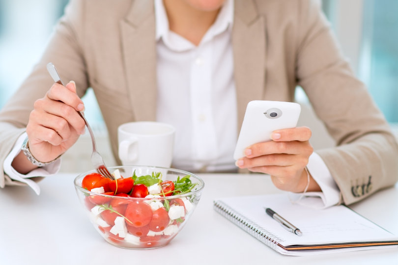 Businesswoman eating healthy