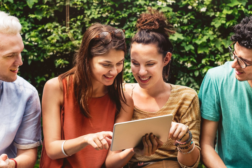 Young people learning online using a tablet PC