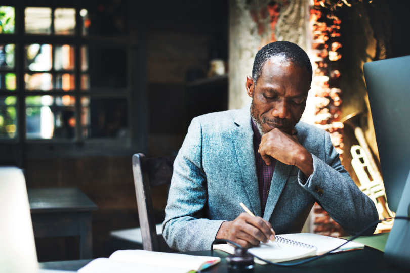 Focused businessman learning about business strategy