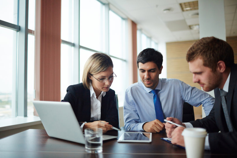 Social media team analyzing competitors