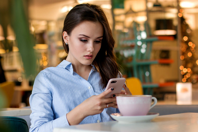 Businesswoman reading tech updates