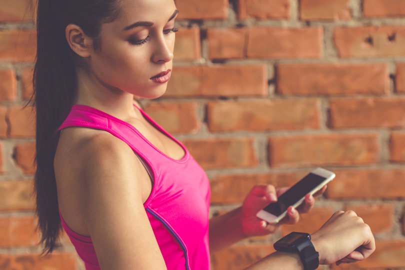 Sporty woman using a health app
