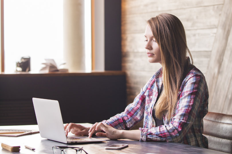 Blogger blogging at her desk