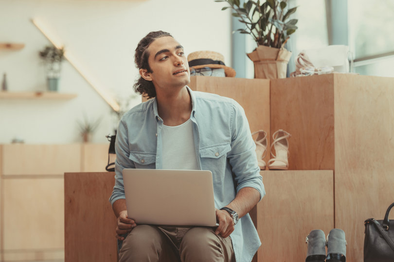 Shoe store owner doing digital marketing