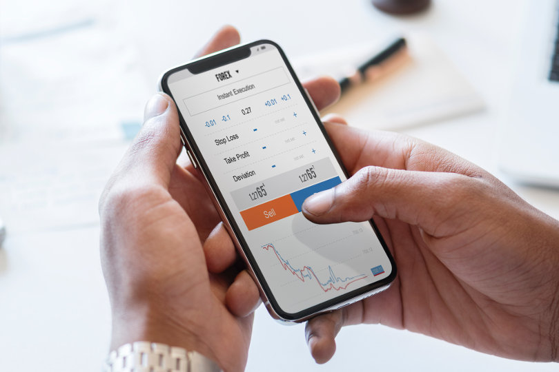 Forex trader using mobile trading platform