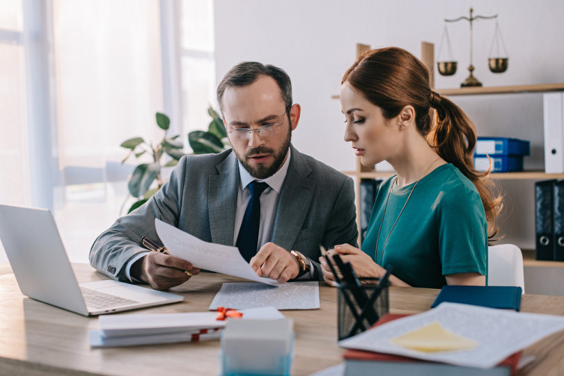 Specialist from a debt management firm consulting a client