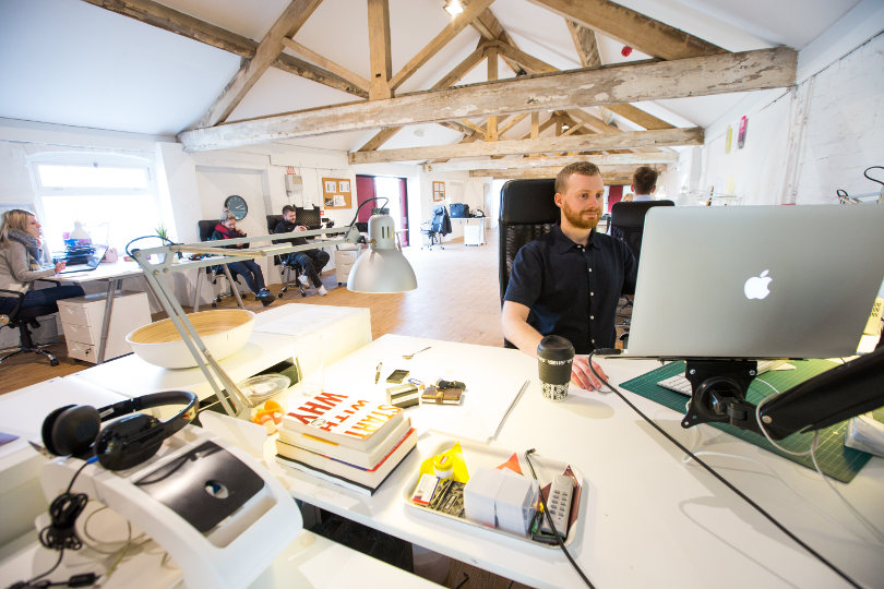 Team of software developers working in a vibrant office