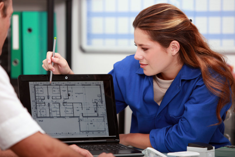 Electrician explaining work to customer