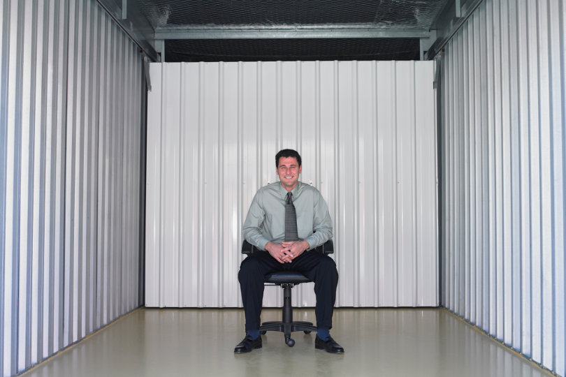 Businessman in a self storage space