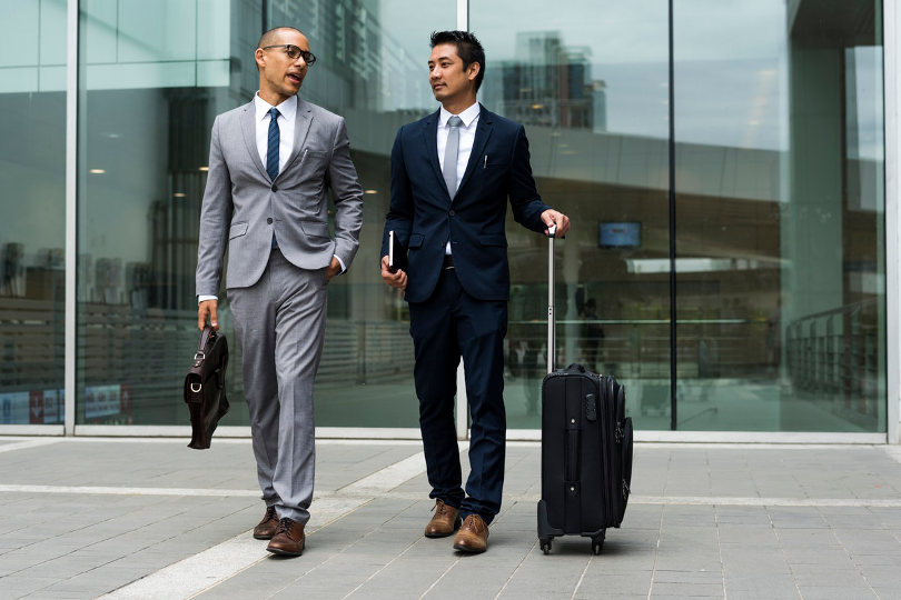 Businessmen with suitcases
