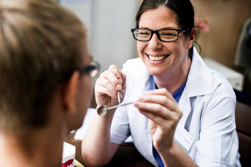 Dentist treating patient