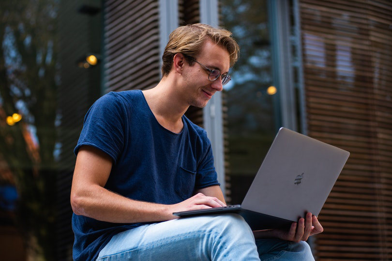 Businessman accessing the internet via laptop