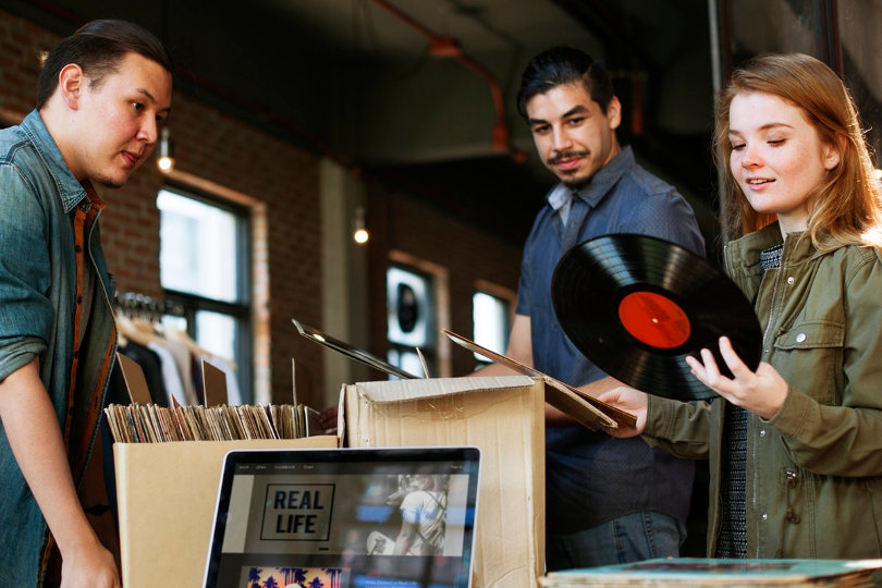 Record shop owner and customers