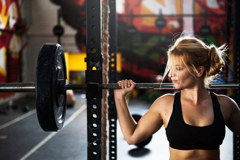 Woman working out, lifting weight