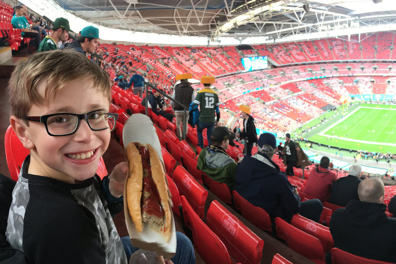 Kid with hotdog at NFL London game 2017