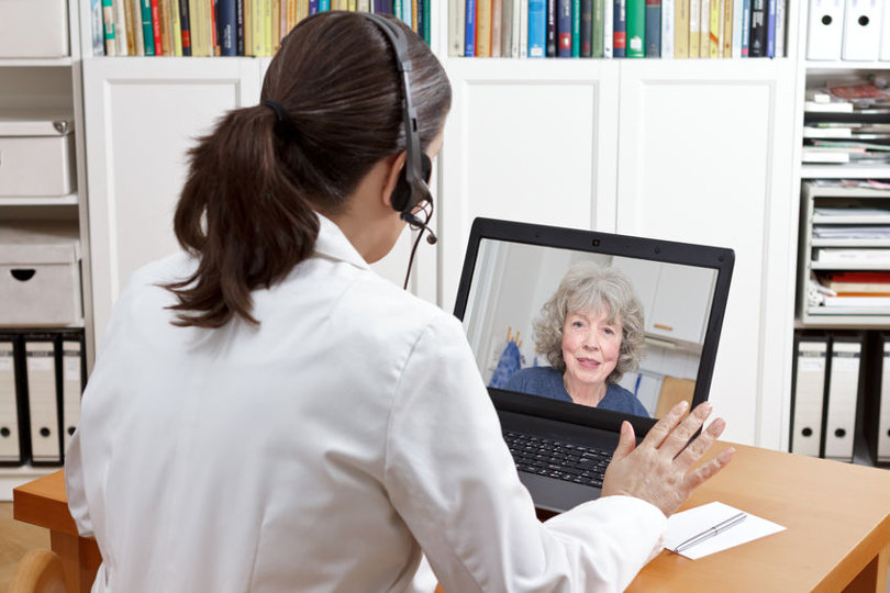 Doctor advising patient using telehealth technology