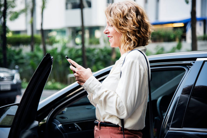 Businesswoman sending text messages