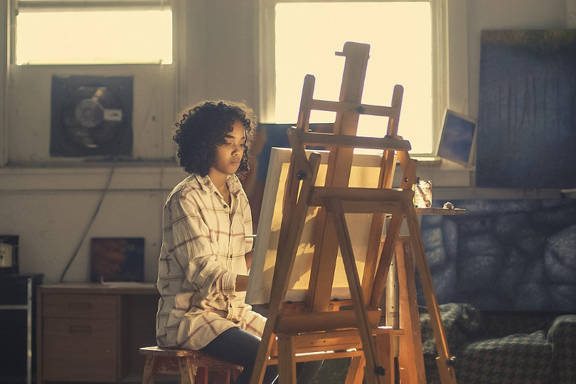 Businesswoman doing painting as a hobby