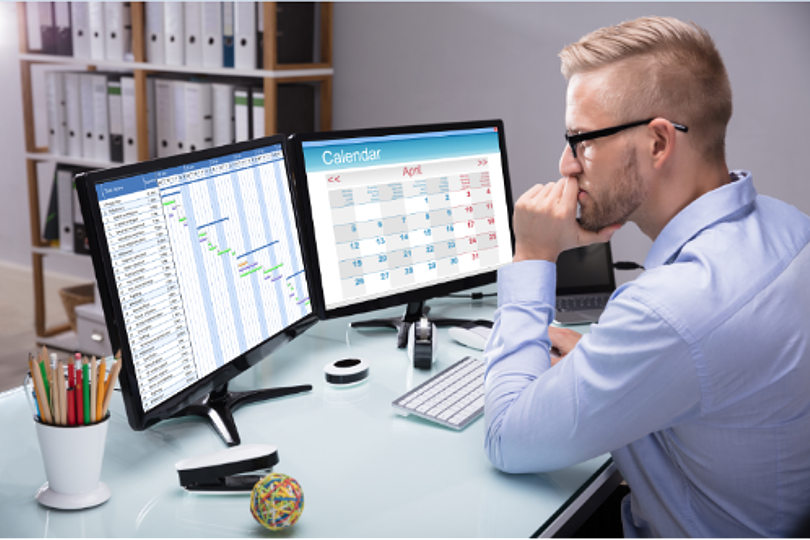 Businessman using scheduling software