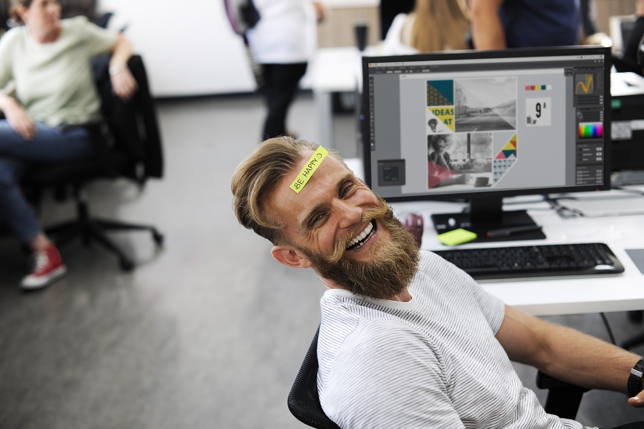 Man smiling while taking a breather from work