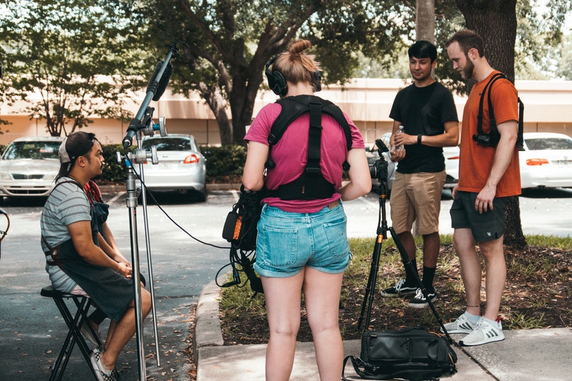 Film team creating branding video outside