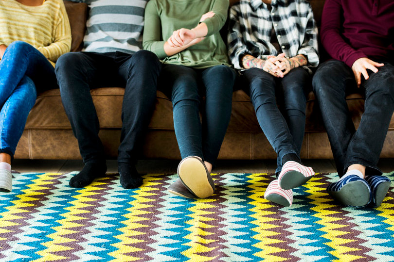 Feet on a printed rug