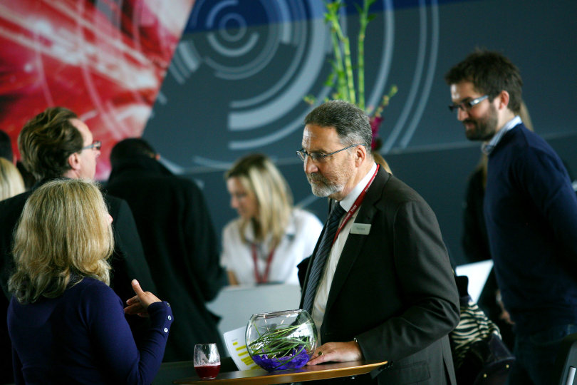 Corporate event attendees mingling