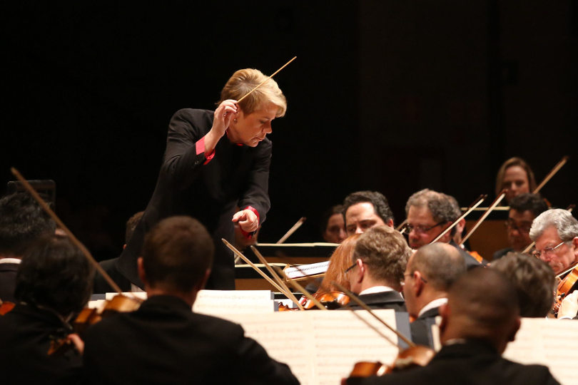 Marin Alsop conducting an orchestra