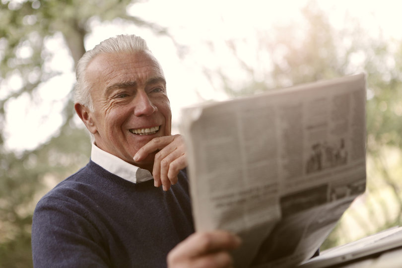 Boomer reading newspaper