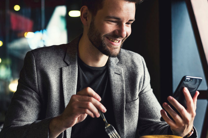 Businessman reading text message