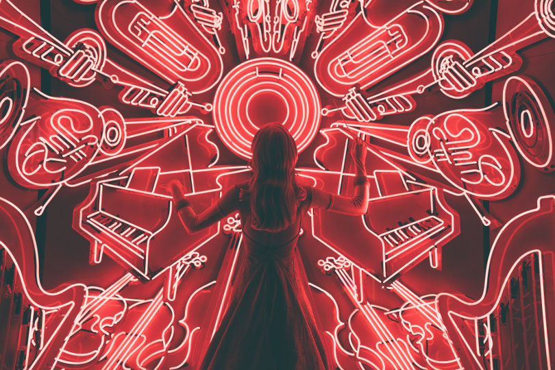 Woman with neon musical instruments