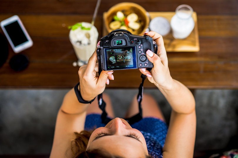 Influencer photographs her food for her social media post