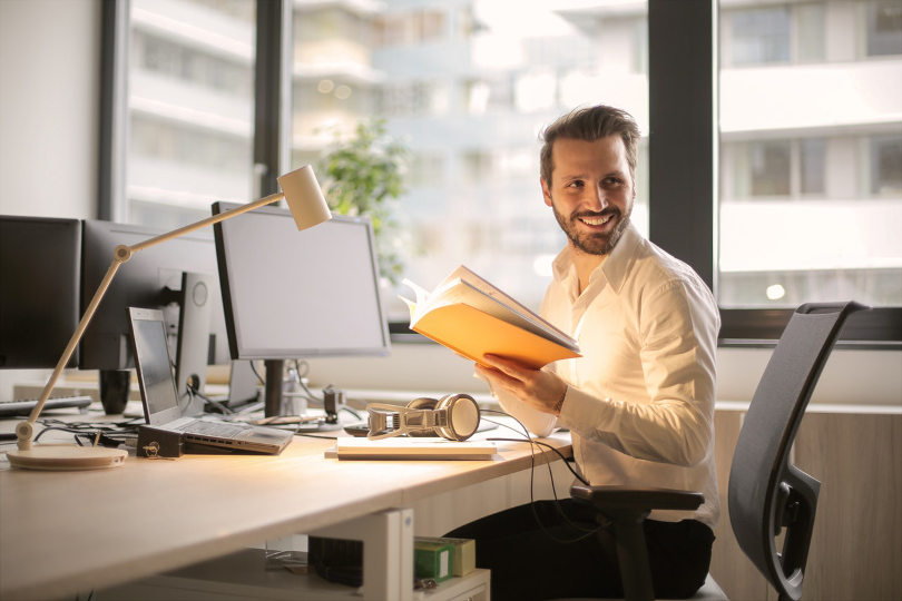 Happy finance guy seeing positive cash flow