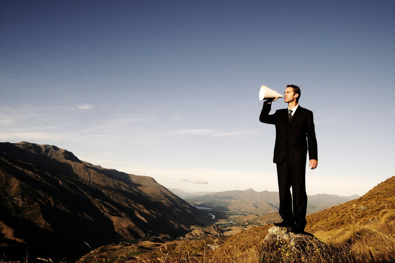 Businessman using megaphone