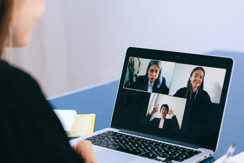 Businesswoman talks in a Zoom video meeting