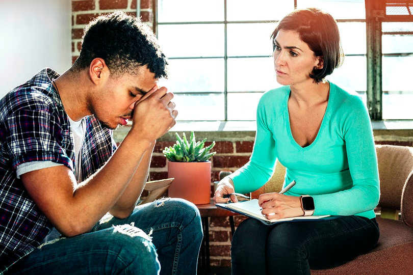 Social worker giving counselling session