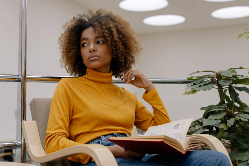 Businesswoman reading business book