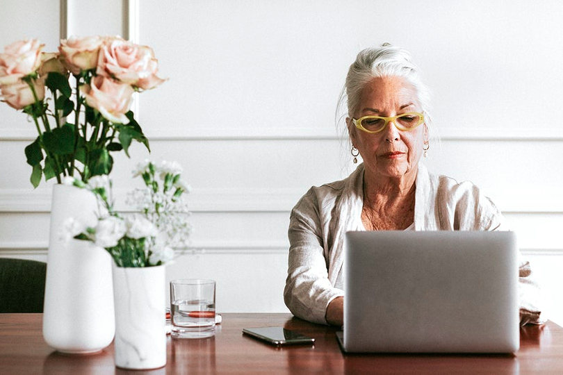 Senior businesswoman working on a side hustle