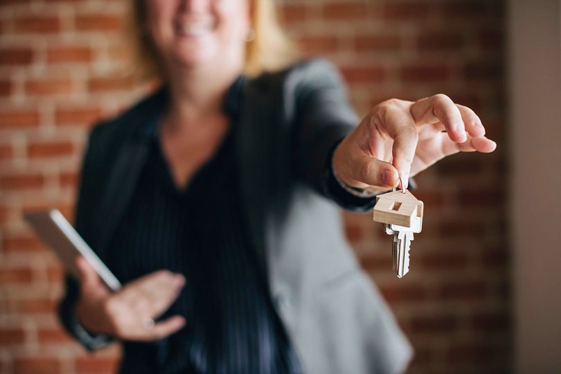 Landlord handing out property keys