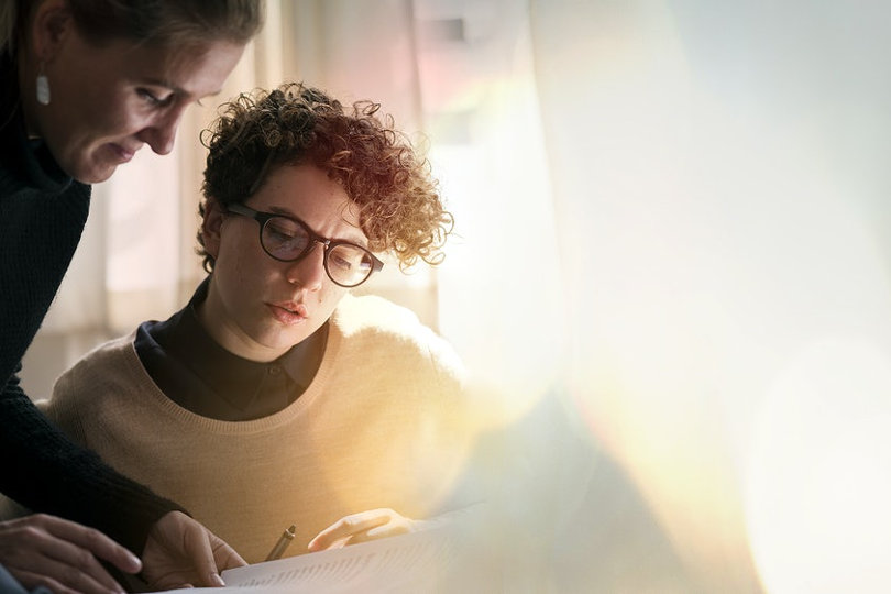 Businesswomen writing business plan