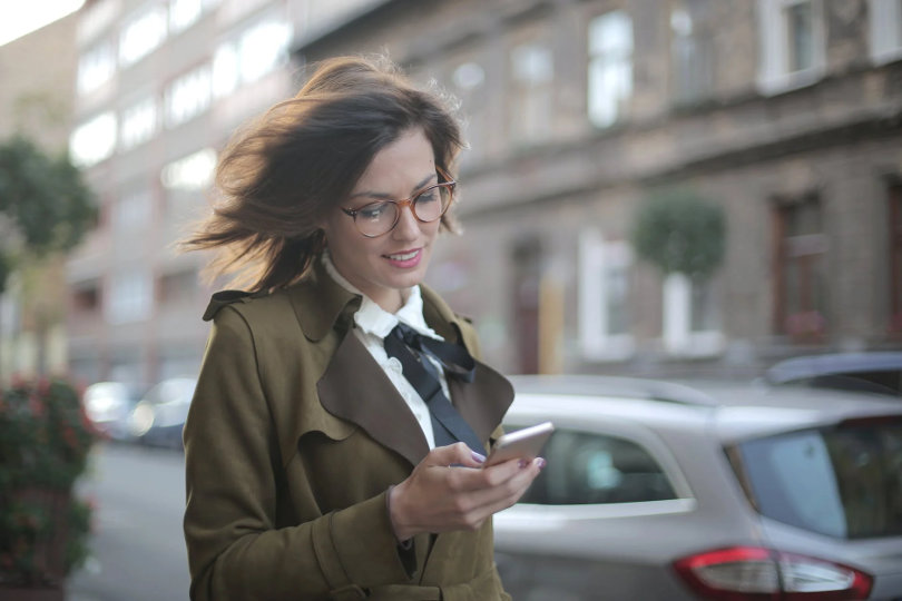 A businesswoman using a new app