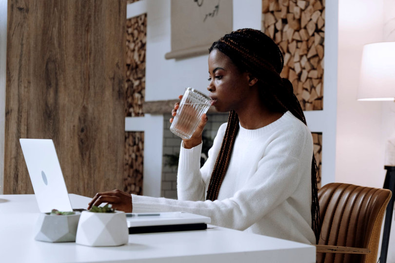 Businesswoman drinking water