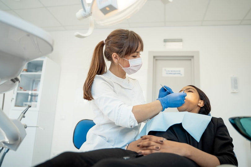 Dentist and client in a dental clinic