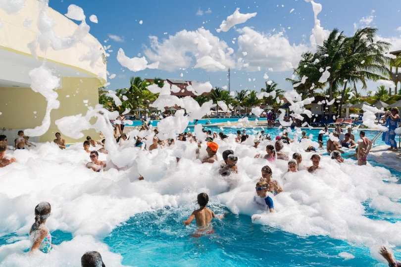 Kids foam party in a pool