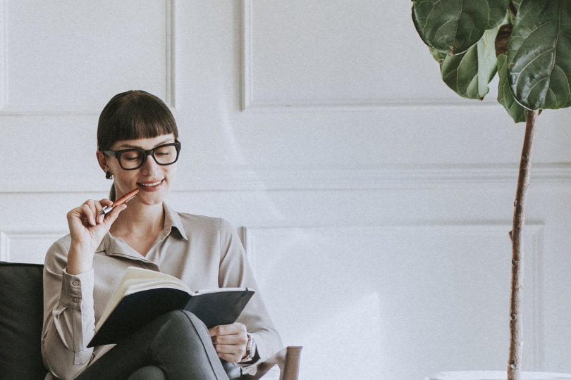 Businesswoman reading business book