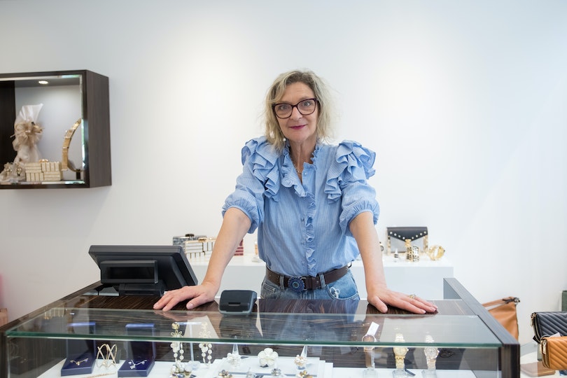 The owner of a jewelry business in her shop